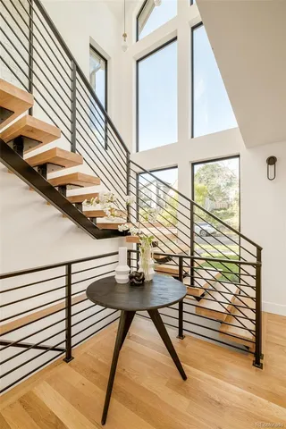 a view of entryway and hall with wooden floor