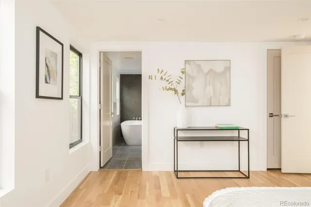 a bedroom with a bed and a lamp