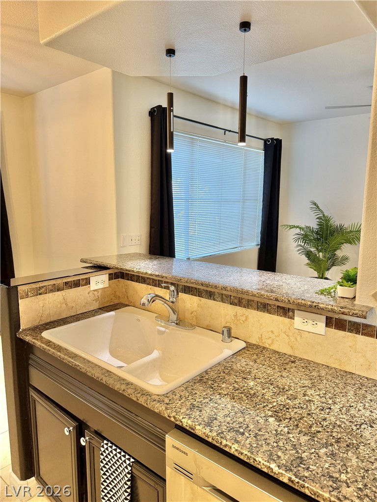 9050 West Warm Springs Road, Unit 1030 Las Vegas, NV 89148 - Photo 12 of 60 BREAKFAST BAR OPEN CONCEPT KITCHEN.