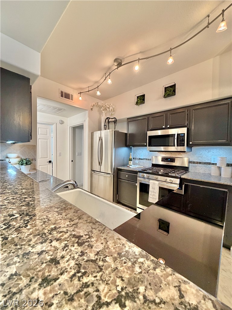 9050 West Warm Springs Road, Unit 1030 Las Vegas, NV 89148 - Photo 55 of 60 SO MUCH COUNTER SPACE!