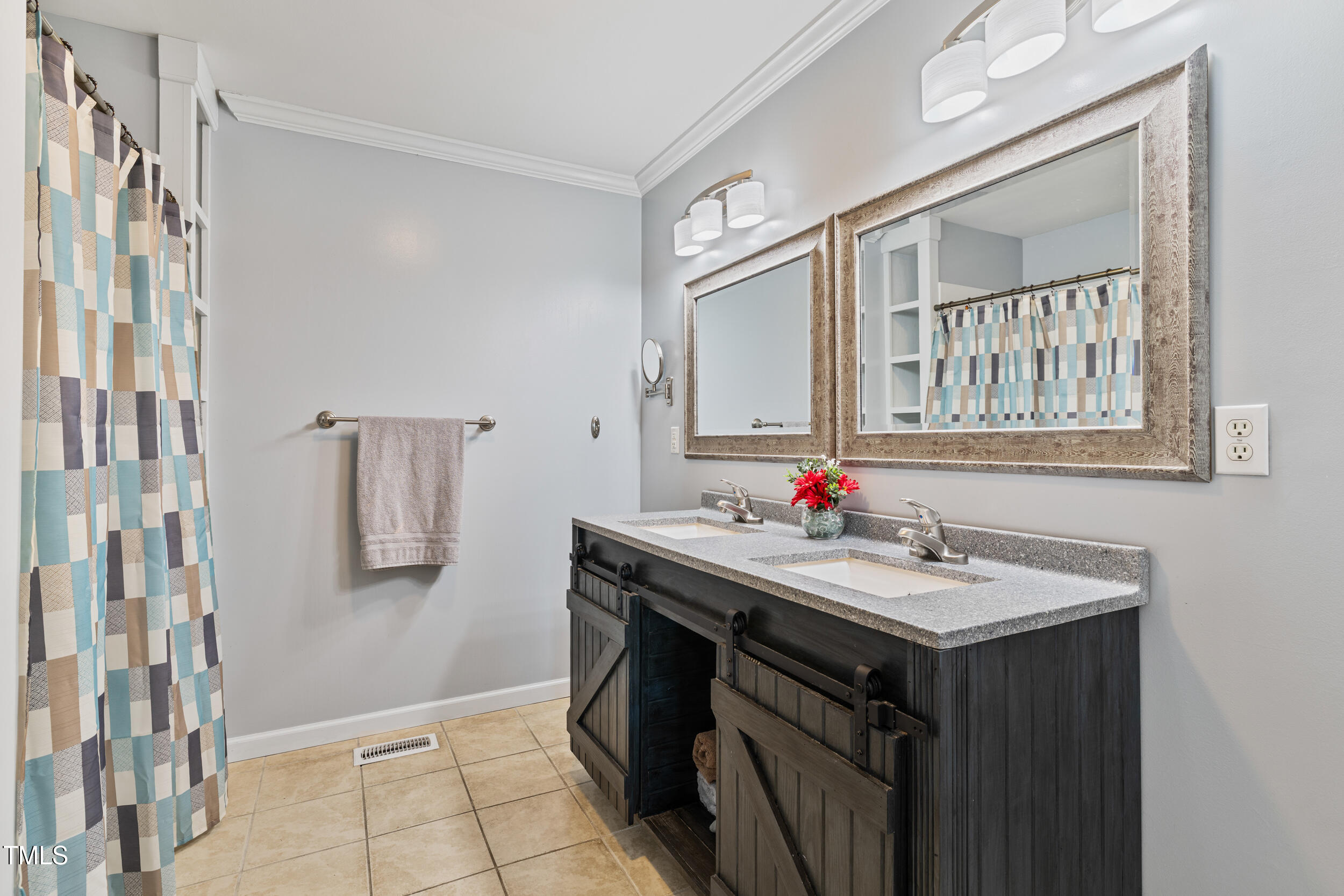 7155 Old Fairground Road Benson, NC 27504 - Photo 13 of 25 a bathroom with a sink and a mirror