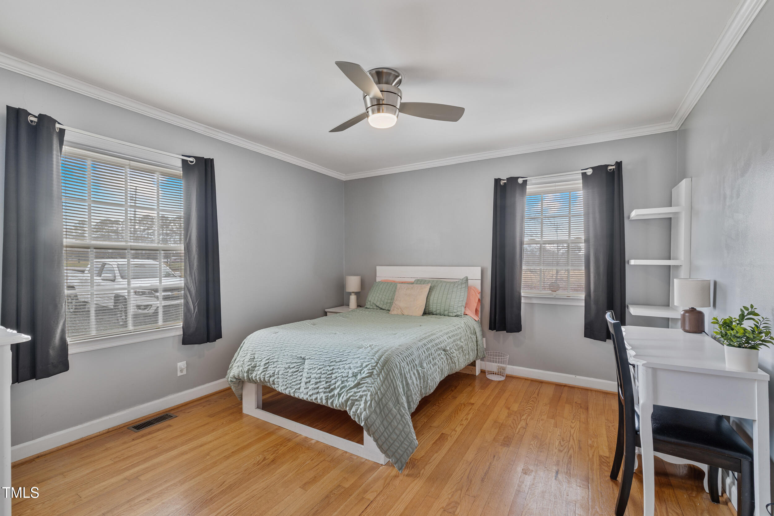 7155 Old Fairground Road Benson, NC 27504 - Photo 14 of 25 a bedroom with a bed a table and chair