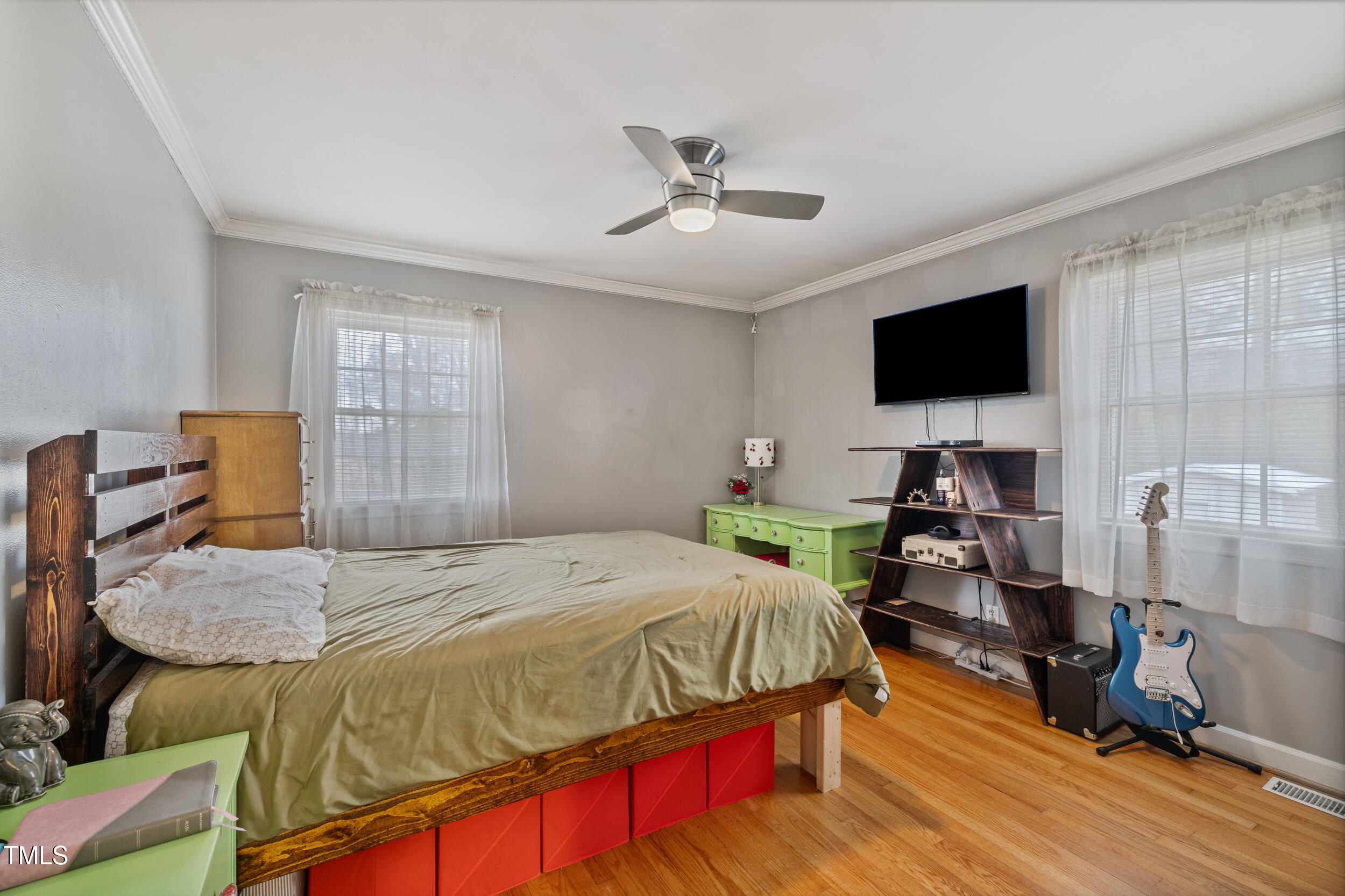 7155 Old Fairground Road Benson, NC 27504 - Photo 15 of 25 a bedroom with a bed and a flat screen tv
