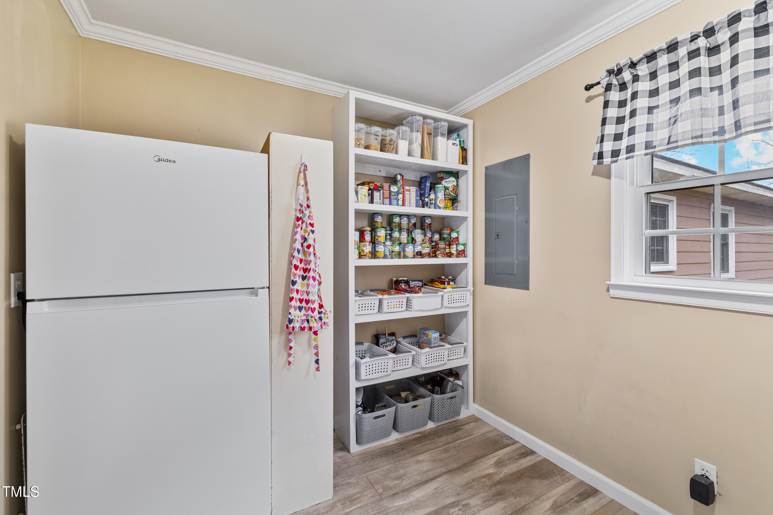 7155 Old Fairground Road Benson, NC 27504 - Photo 19 of 25 a white refrigerator freezer and a wooden floor