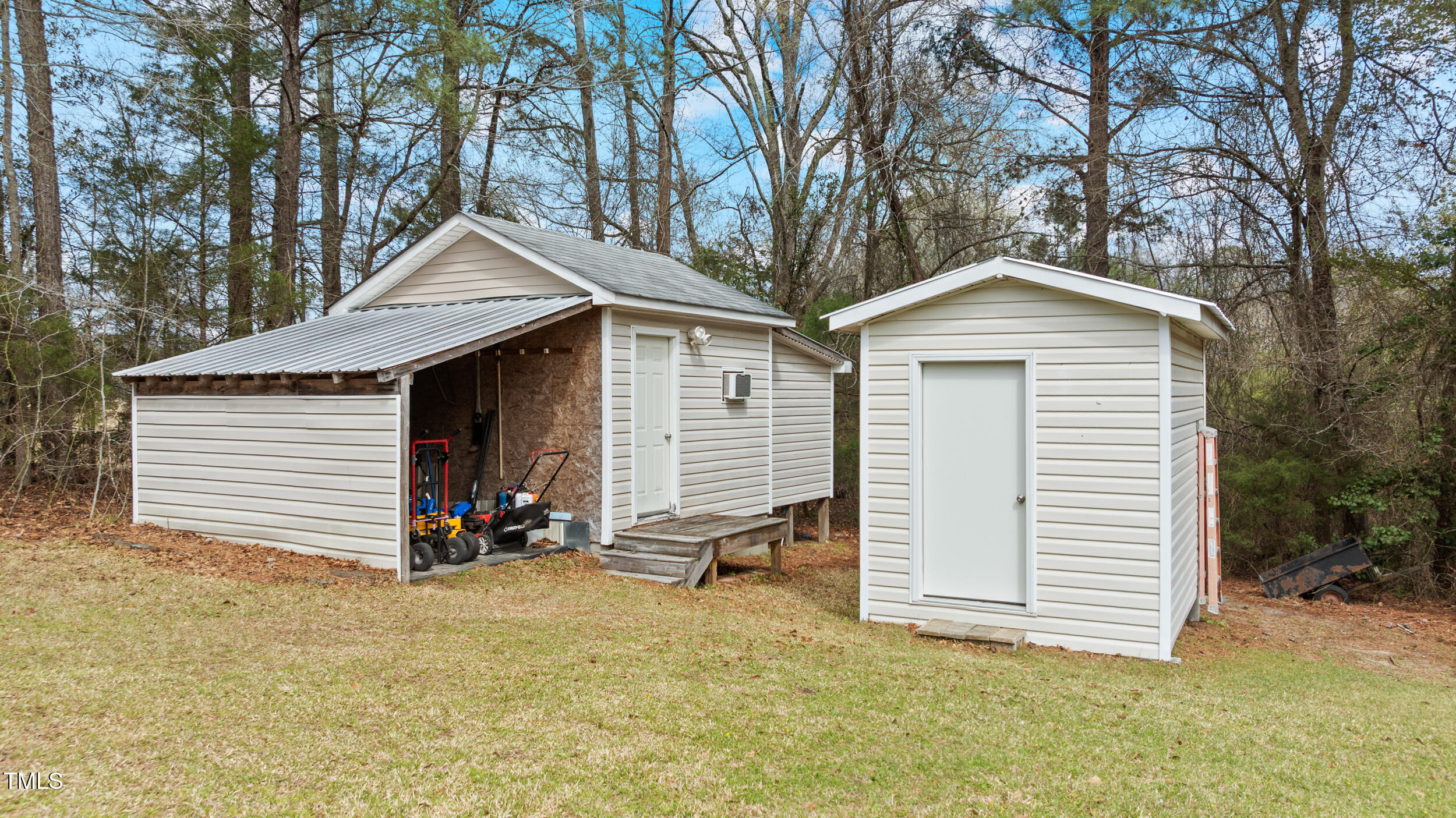 7155 Old Fairground Road Benson, NC 27504 - Photo 24 of 25 a view of a house with a yard and garage
