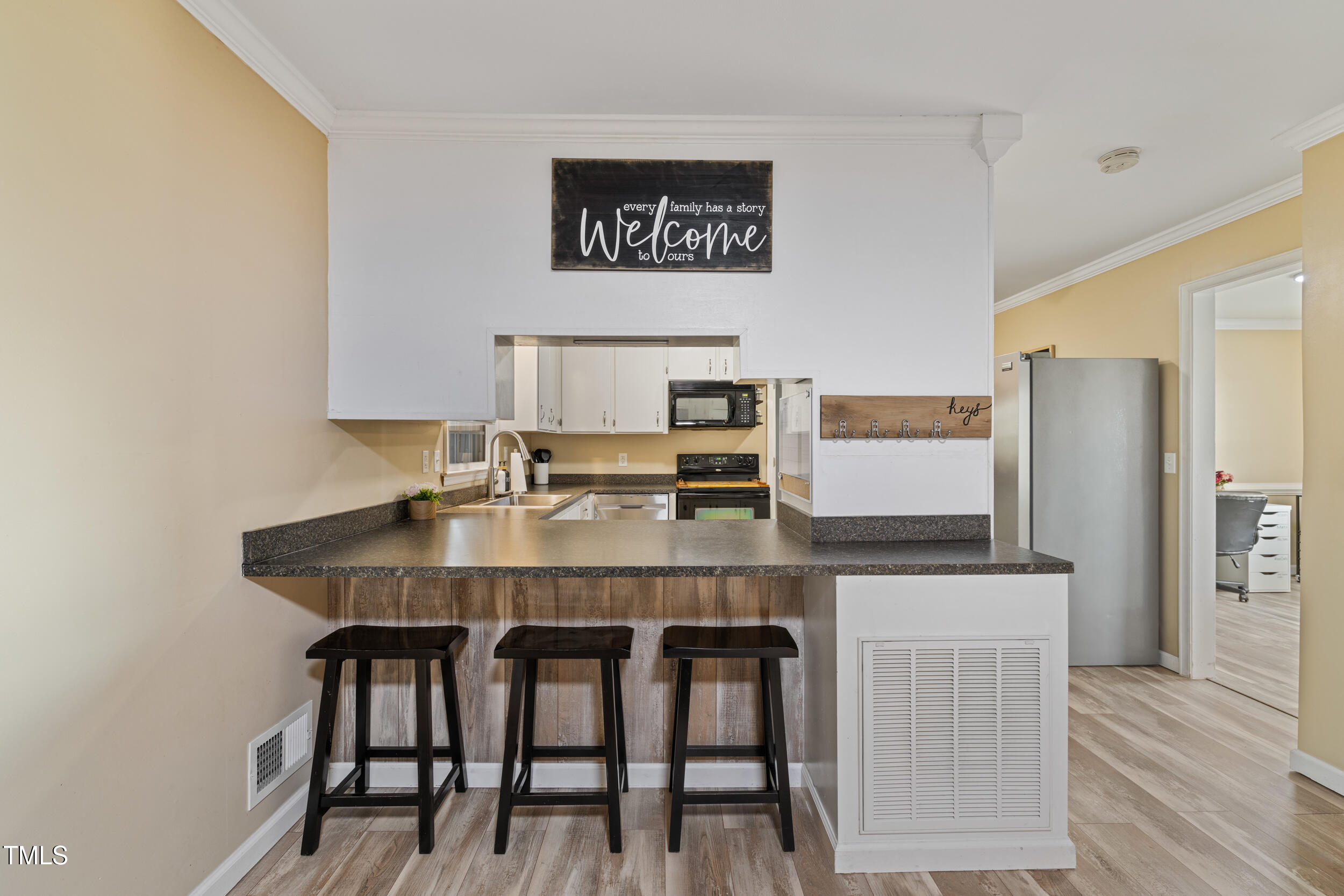 7155 Old Fairground Road Benson, NC 27504 - Photo 8 of 25 a view of a kitchen with a table and chairs