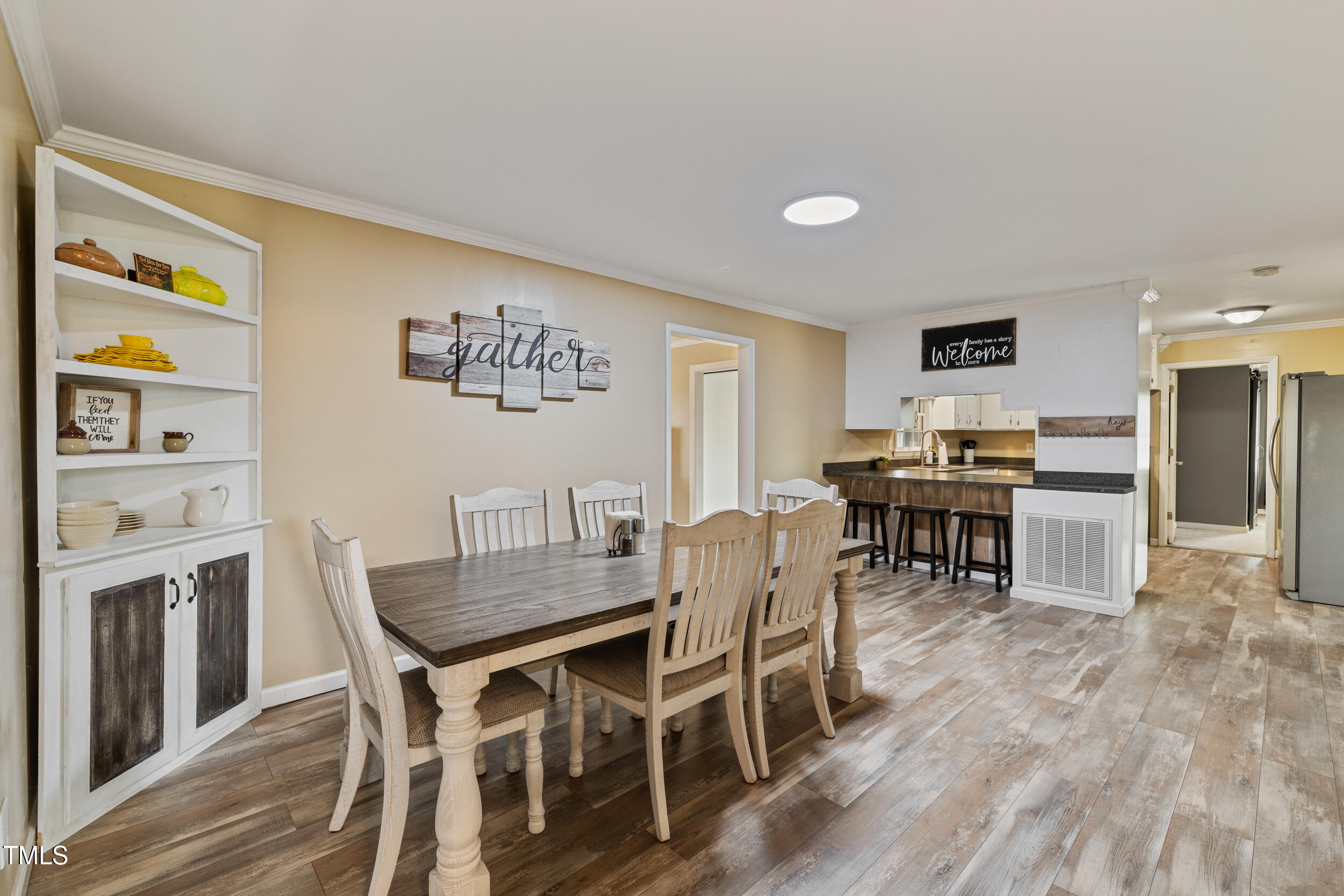 7155 Old Fairground Road Benson, NC 27504 - Photo 9 of 25 a view of a dining room with furniture and wooden floor