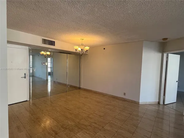a view of a hallway with wooden shelves