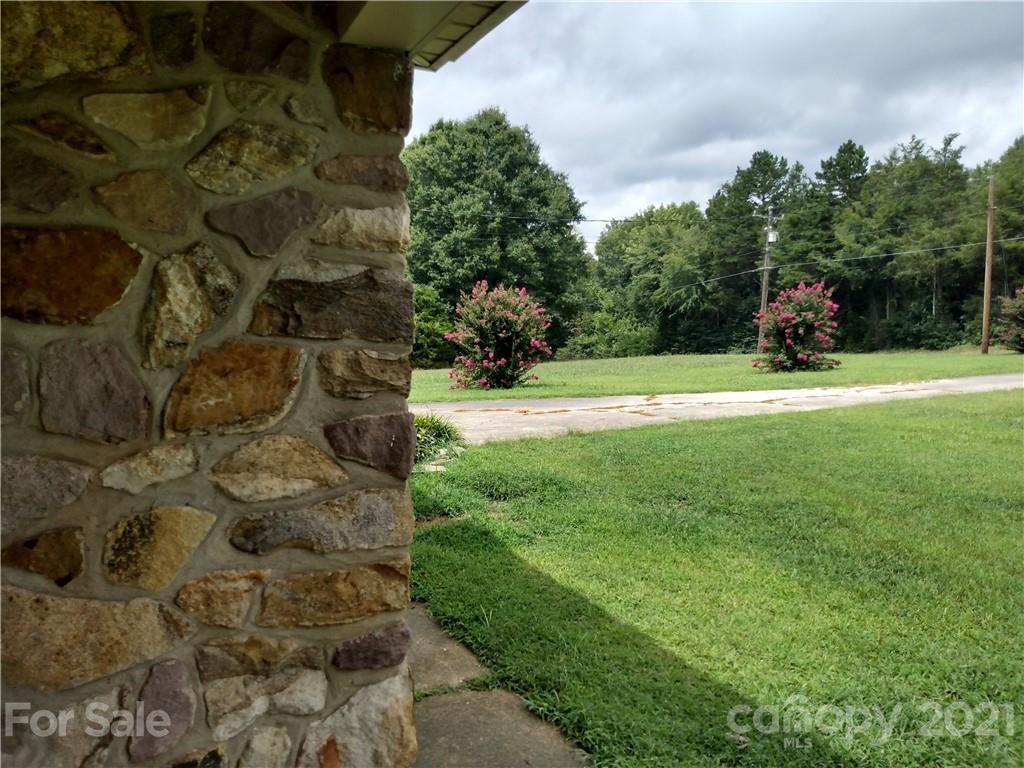 4270 Garmon Mill Road Midland, NC 28107 - Photo 14 of 37 a view of a garden with a building in the background
