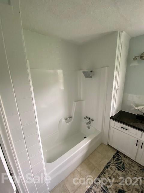 4270 Garmon Mill Road Midland, NC 28107 - Photo 28 of 37 a bathroom with a bathtub and a shower