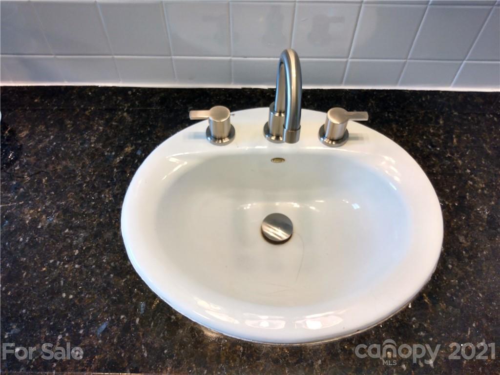 4270 Garmon Mill Road Midland, NC 28107 - Photo 34 of 37 a bathroom with a sink and a mirror