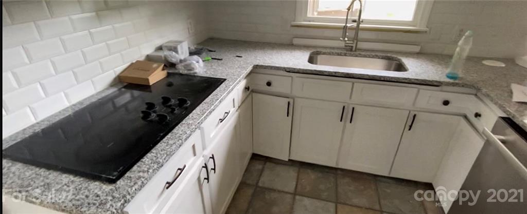 4270 Garmon Mill Road Midland, NC 28107 - Photo 5 of 37 a kitchen with a sink and cabinets