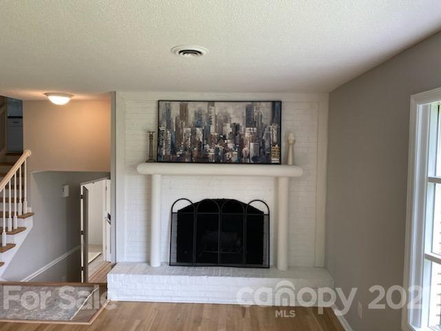4270 Garmon Mill Road Midland, NC 28107 - Photo 9 of 37 a view of a livingroom with a fireplace and a window