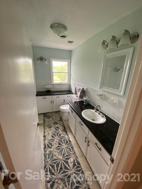 4270 Garmon Mill Road Midland, NC 28107 - Photo 10 of 37 a bathroom with a sink and a mirror