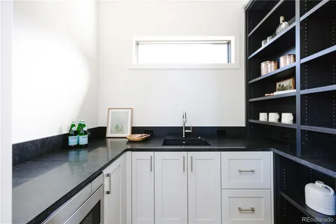 a kitchen with a sink and cabinets