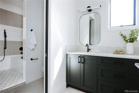 a bathroom with a tub and a shower