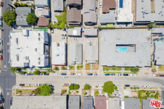 an aerial view of a house with a swimming pool