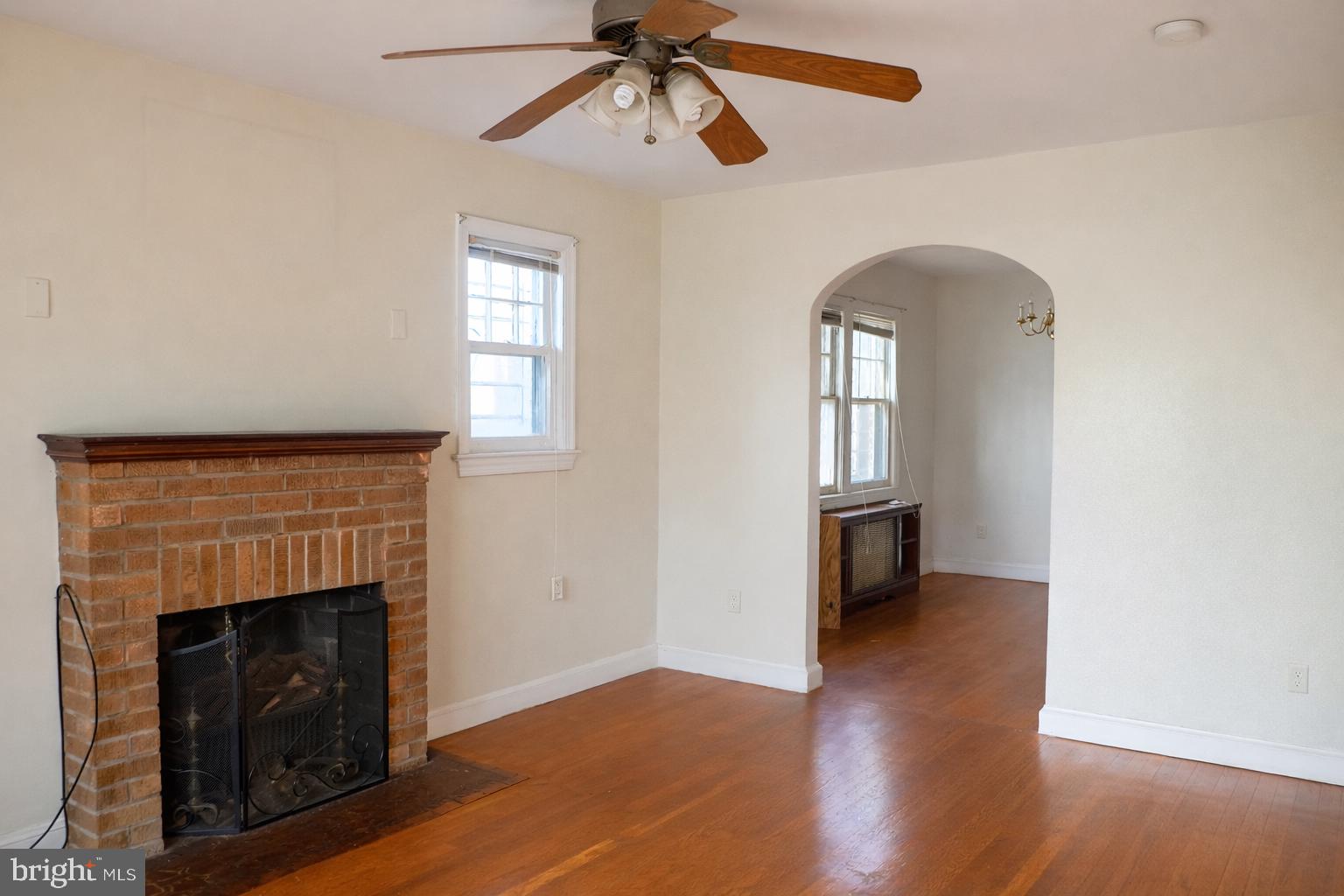 1464 Morris Road Southeast Washington, DC 20020 - Photo 3 of 23 a view of an empty room with wooden floor and a window