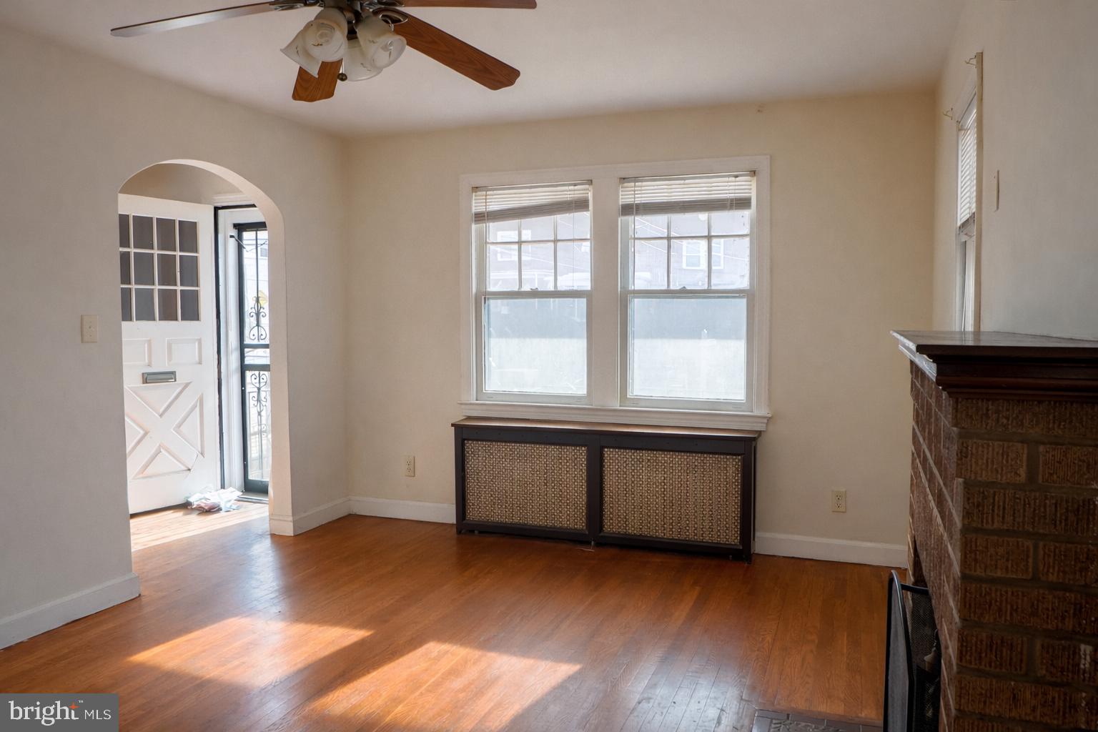 1464 Morris Road Southeast Washington, DC 20020 - Photo 5 of 23 a view of an empty room with window and wooden floor