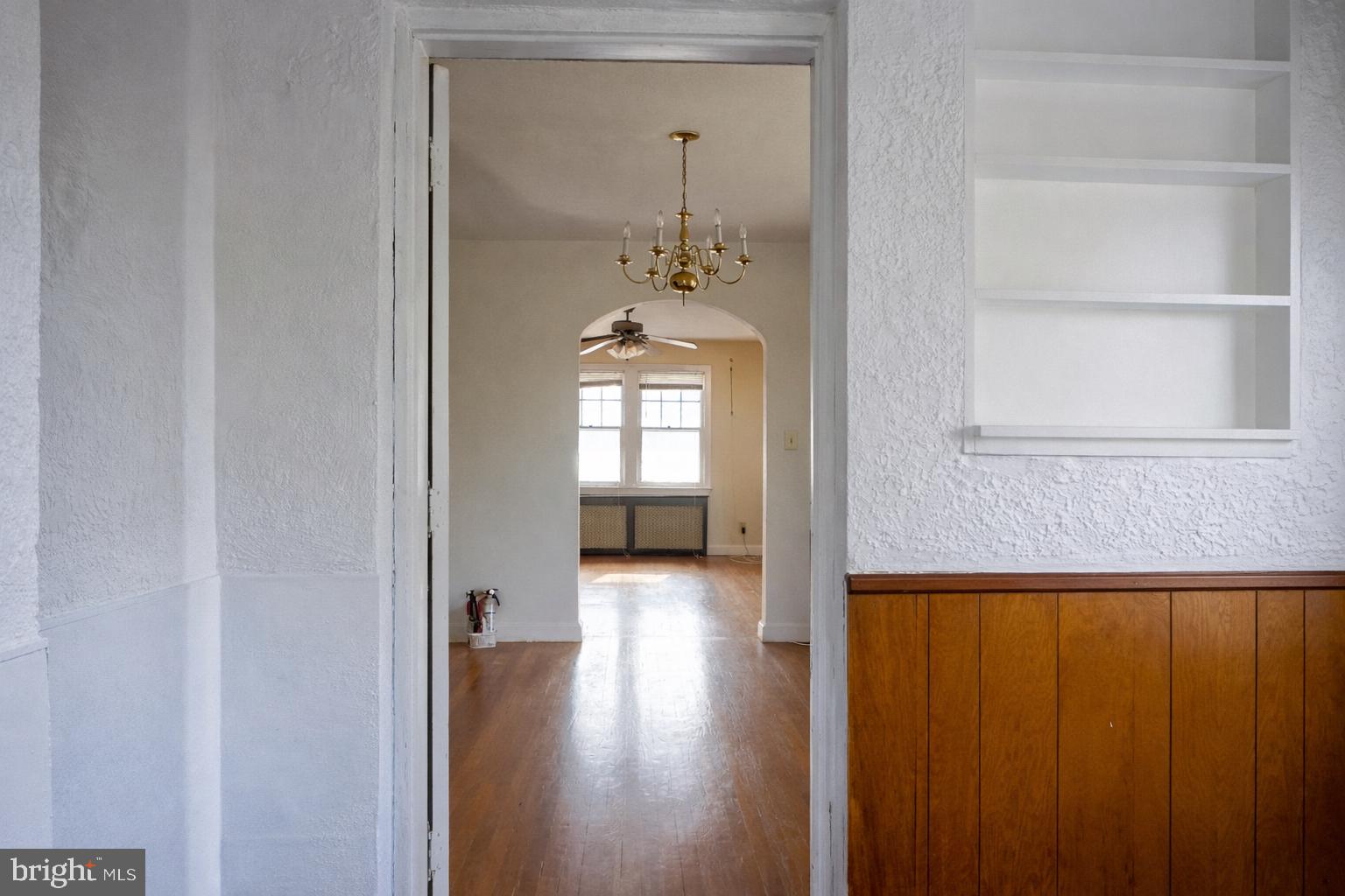 1464 Morris Road Southeast Washington, DC 20020 - Photo 6 of 23 a view of a hallway with wooden floor and a bathroom