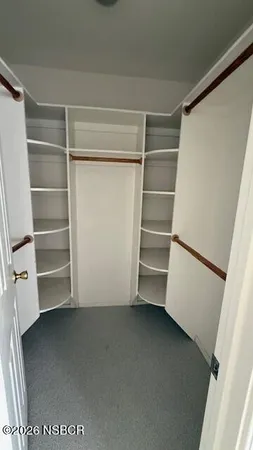 a view of an empty walk in closet