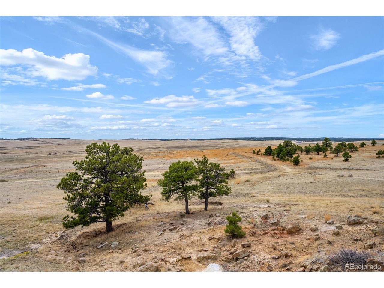 77 County Road Calhan, CO 80808 - Photo 26 of 32 a view of a lake with beach and city view