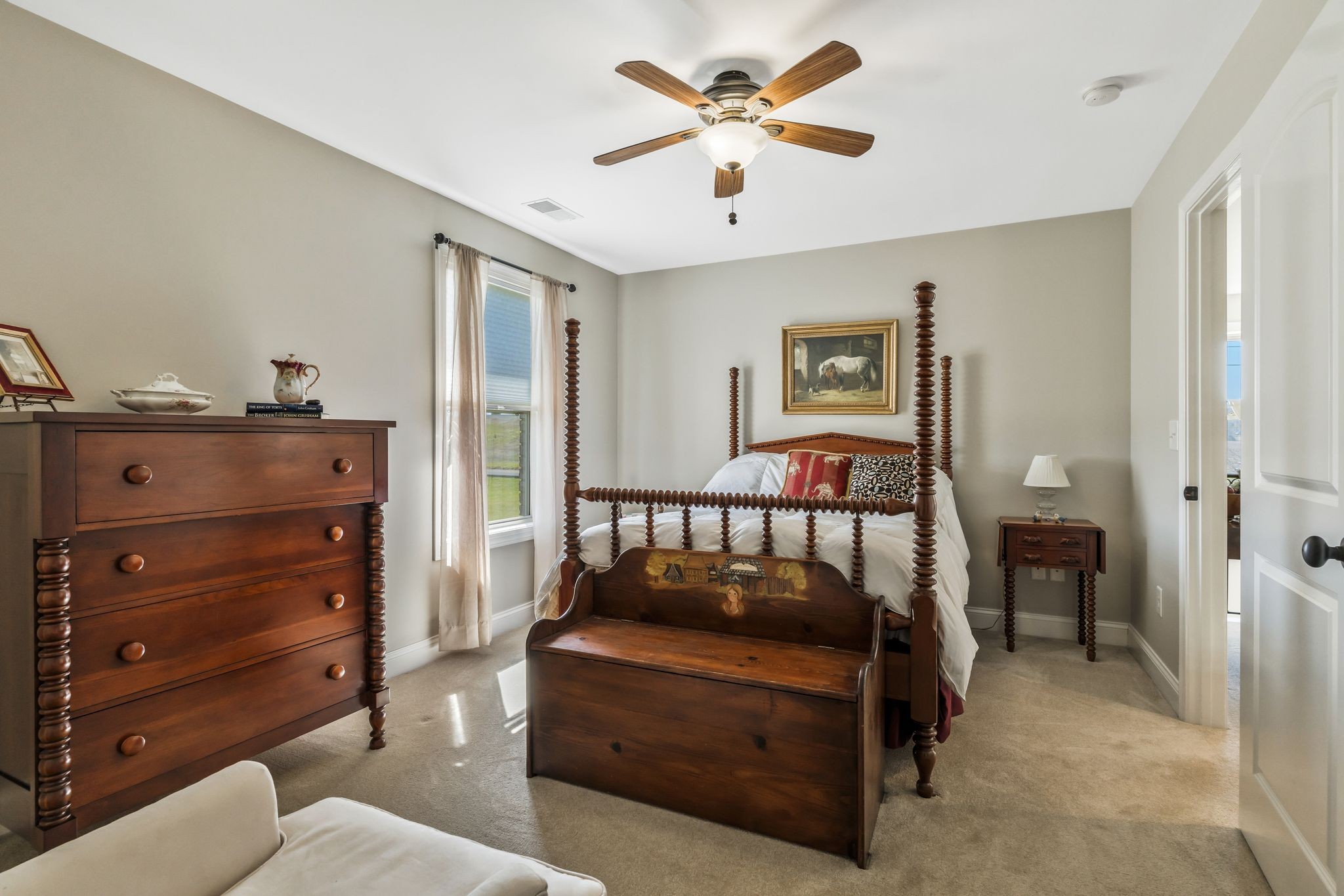 263 Aplin Branch Road Cottontown, TN 37048 - Photo 22 of 29 a bedroom with a bed and a chandelier