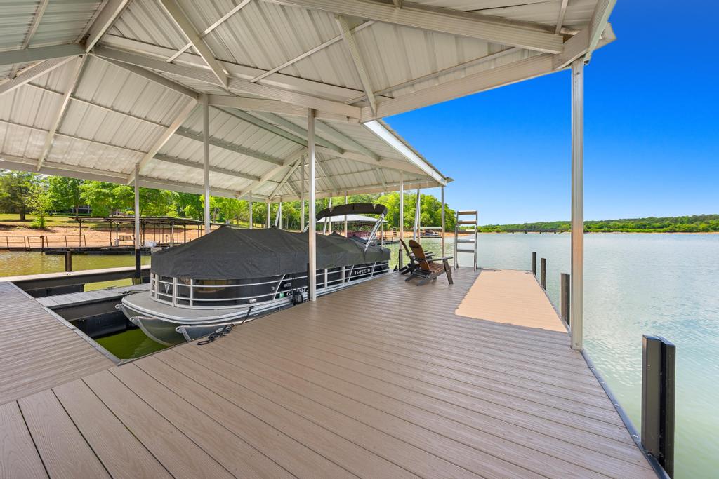 707 Vickery Street Extension Hartwell, GA 30643 - Photo 48 of 50 Boasting direct lake access, this property includes a private boat dock with a covered slip.