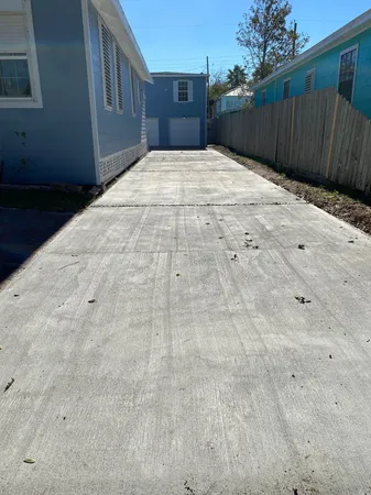 a view of a backyard of the house