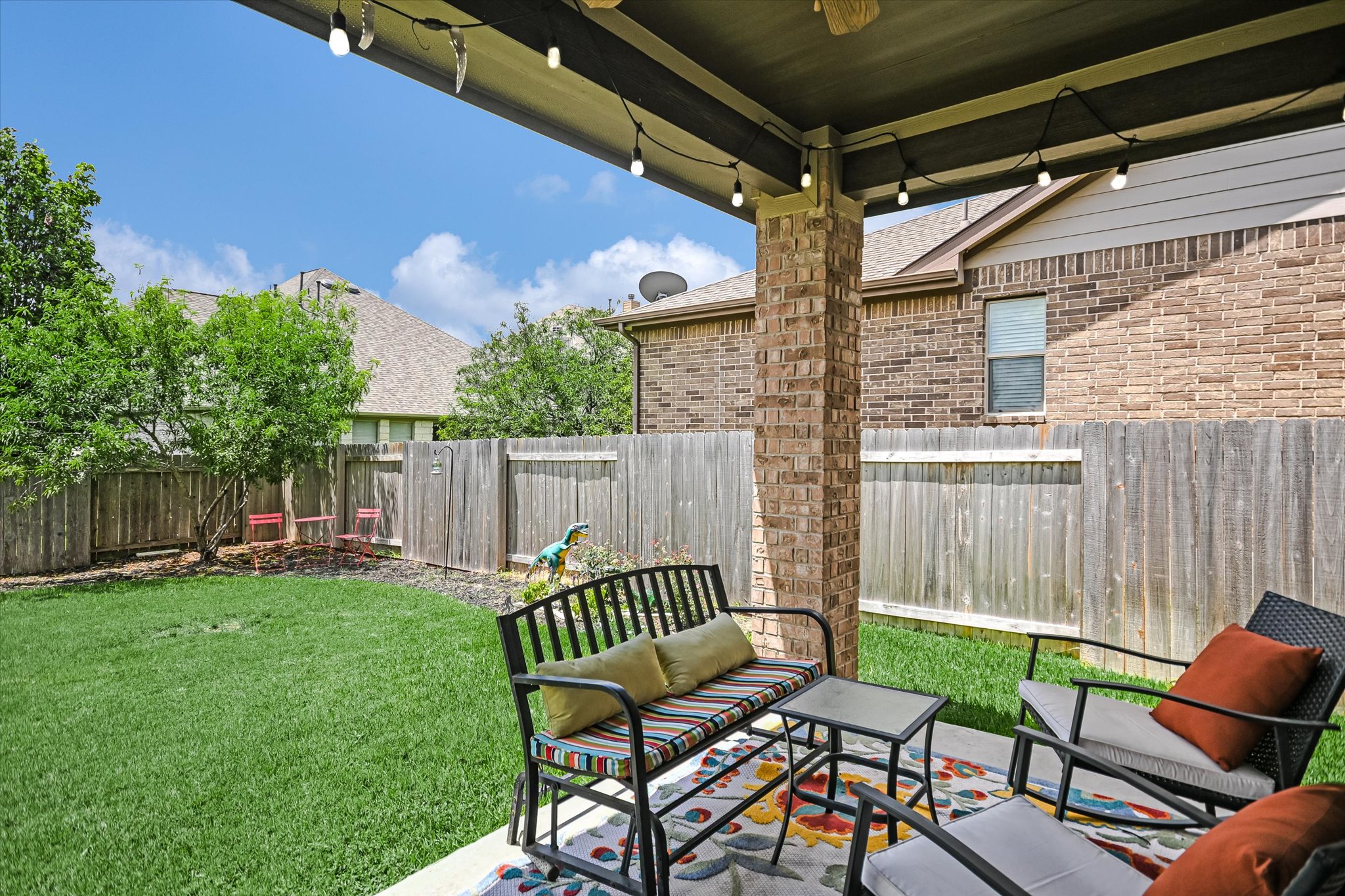 4623 Chestnut Meadows Bend Georgetown, TX 78626 - Photo 27 of 30 a view of a chairs and table in backyard of the house