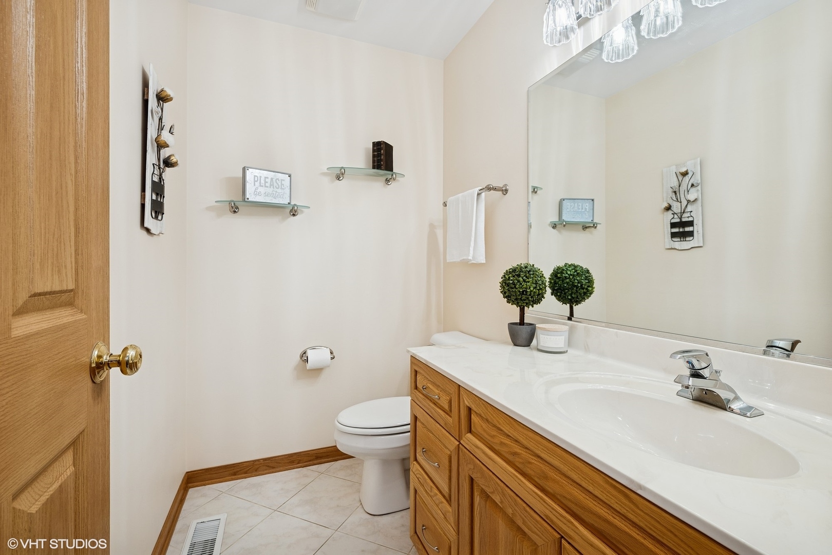 810 Tamarac Drive Algonquin, IL 60102 - Photo 12 of 36 a bathroom with a sink a toilet and mirror