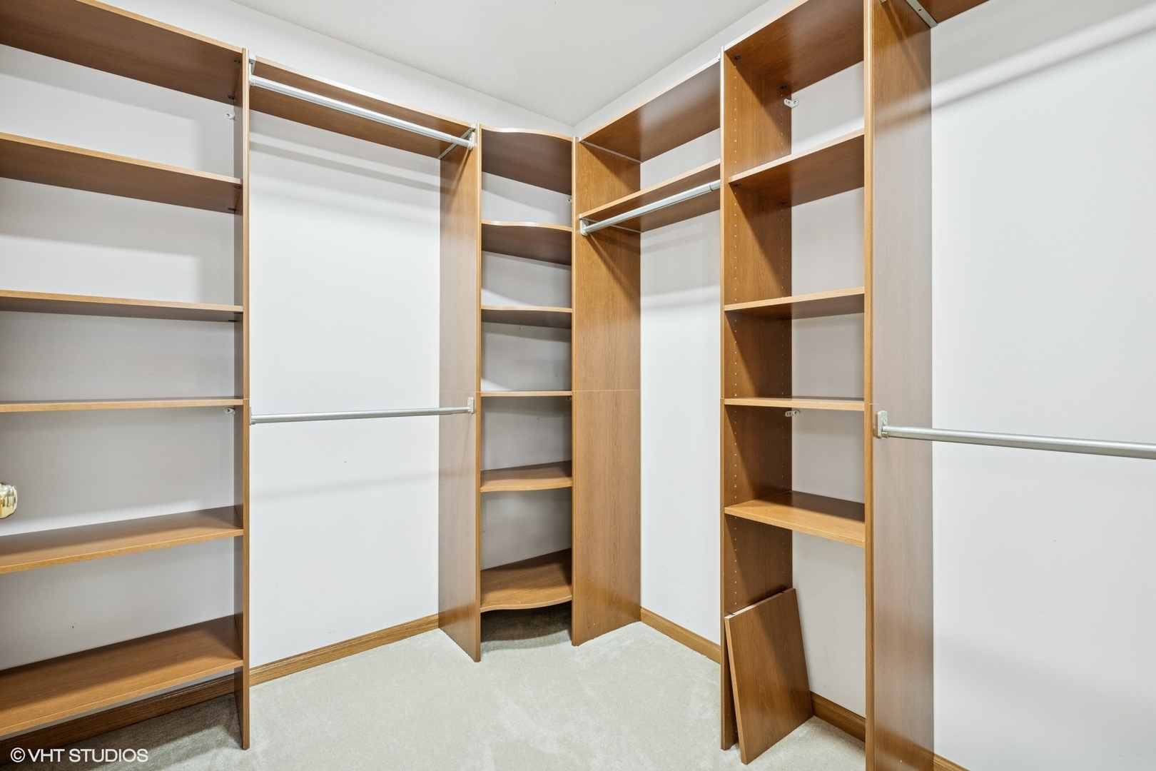 810 Tamarac Drive Algonquin, IL 60102 - Photo 17 of 36 a view of walk in closet with empty racks