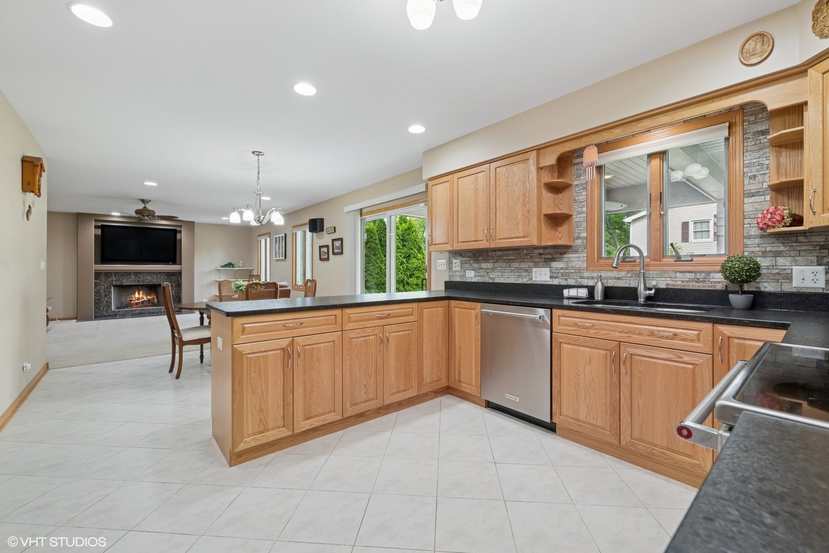 810 Tamarac Drive Algonquin, IL 60102 - Photo 9 of 36 a large kitchen with stainless steel appliances kitchen island granite countertop a sink and cabinets