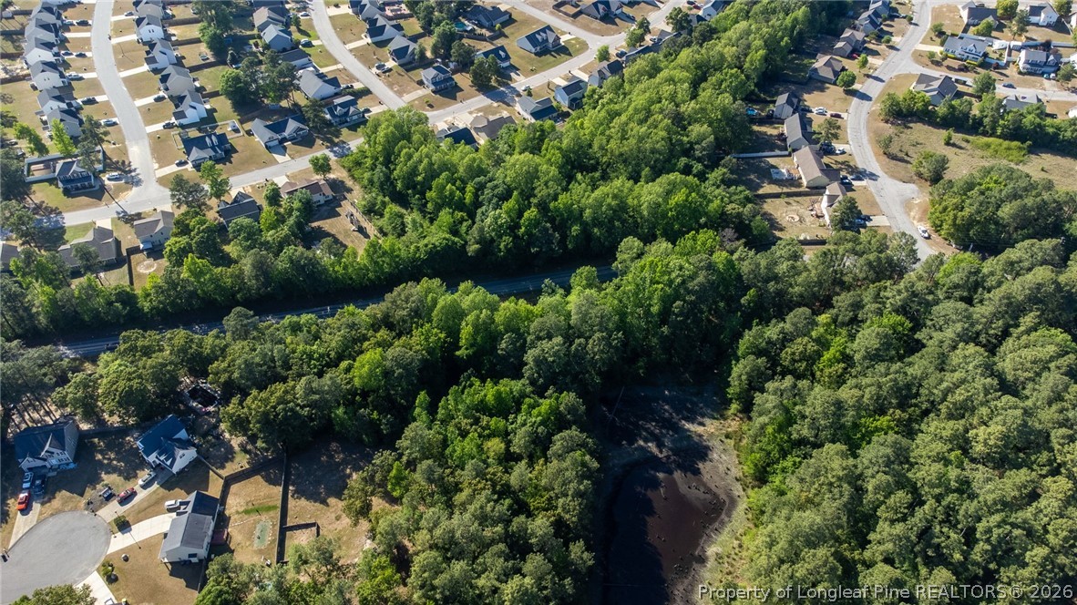 6331 Muscat Road Hope Mills, NC 28348 - Photo 12 of 41 an aerial view of residential house with outdoor space and trees all around