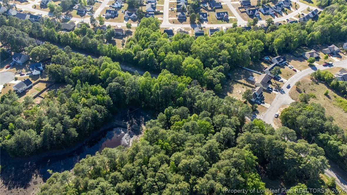 6331 Muscat Road Hope Mills, NC 28348 - Photo 14 of 41 an aerial view of residential house with outdoor space and trees all around