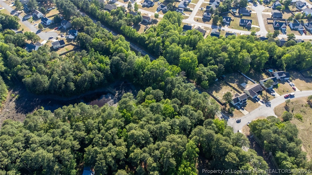 6331 Muscat Road Hope Mills, NC 28348 - Photo 15 of 41 an aerial view of residential house with outdoor space and trees all around