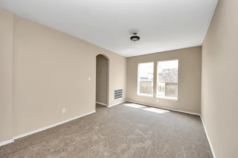 an empty room with a empty space and a window