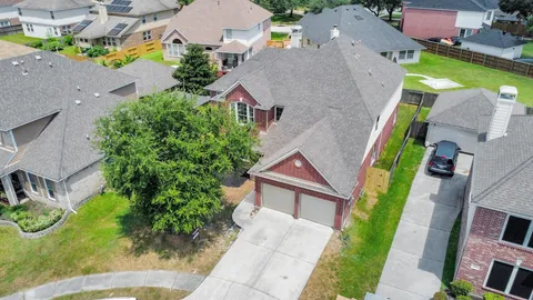 an aerial view of house with yard swimming pool and outdoor seating