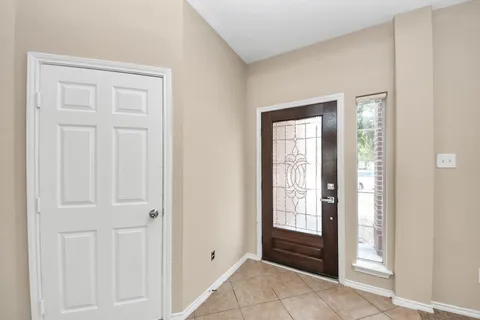 a view of an entryway with wooden floor