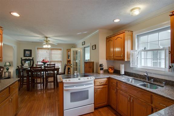 387 North Centerpoint Road Portland, TN 37148 - Photo 14 of 27 a kitchen with lots of counter top space and dining table