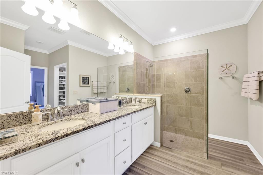 1526 Marton Court Naples, FL 34113 - Photo 18 of 44 master bath dual sinks, walk-in shower, seamless glass
