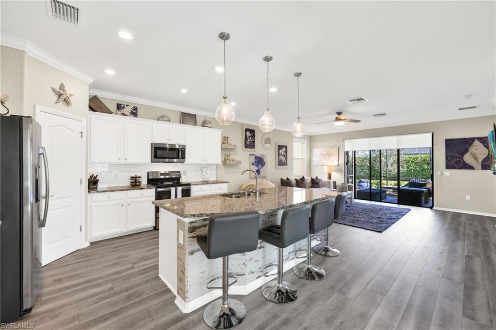 1526 Marton Court Naples, FL 34113 - Photo 3 of 44 open kitchen walk-in pantry