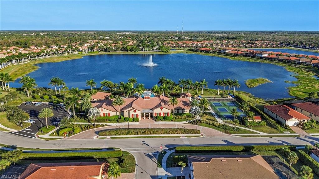 1526 Marton Court Naples, FL 34113 - Photo 31 of 44 clubhouse with large lake to walk around