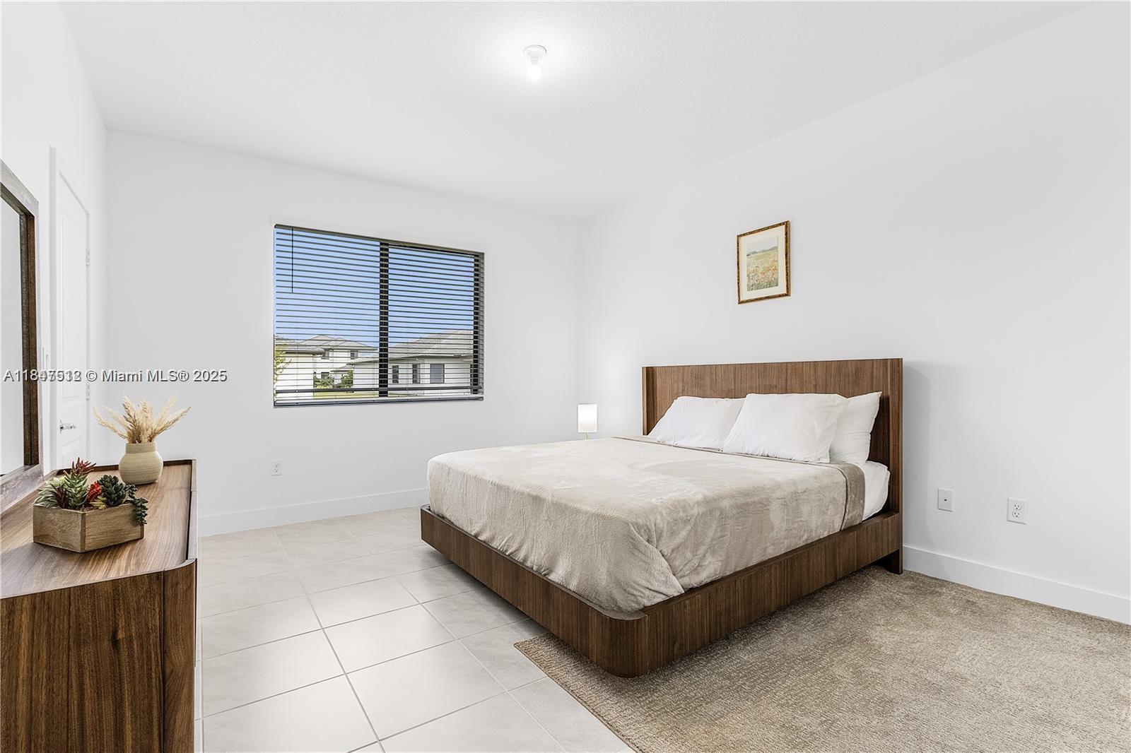 5061 Panella Avenue Immokalee, FL 34142 - Photo 5 of 13 a bedroom with a bed and dresser