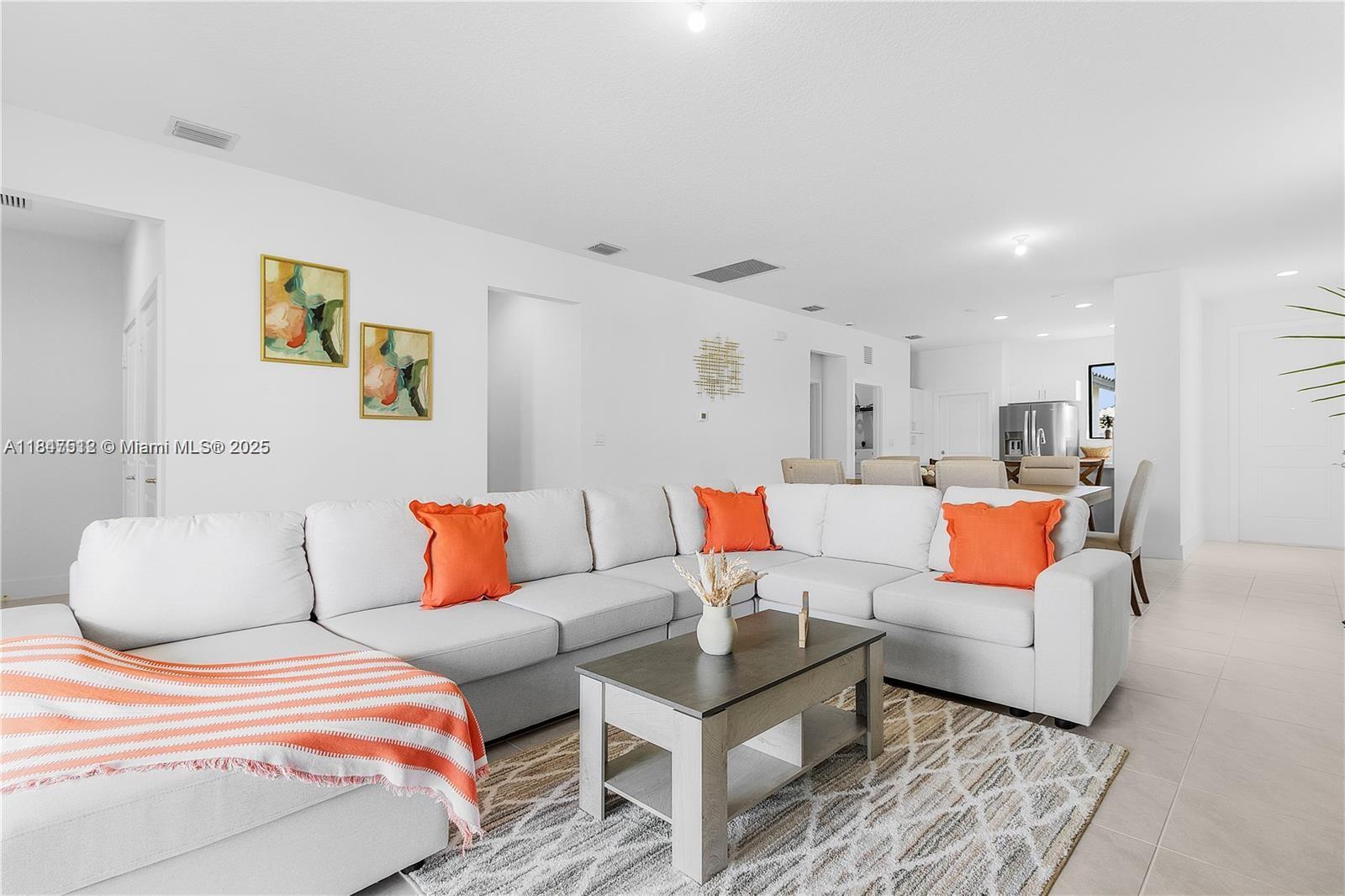 5061 Panella Avenue Immokalee, FL 34142 - Photo 8 of 13 a bedroom with furniture and painting on the wall