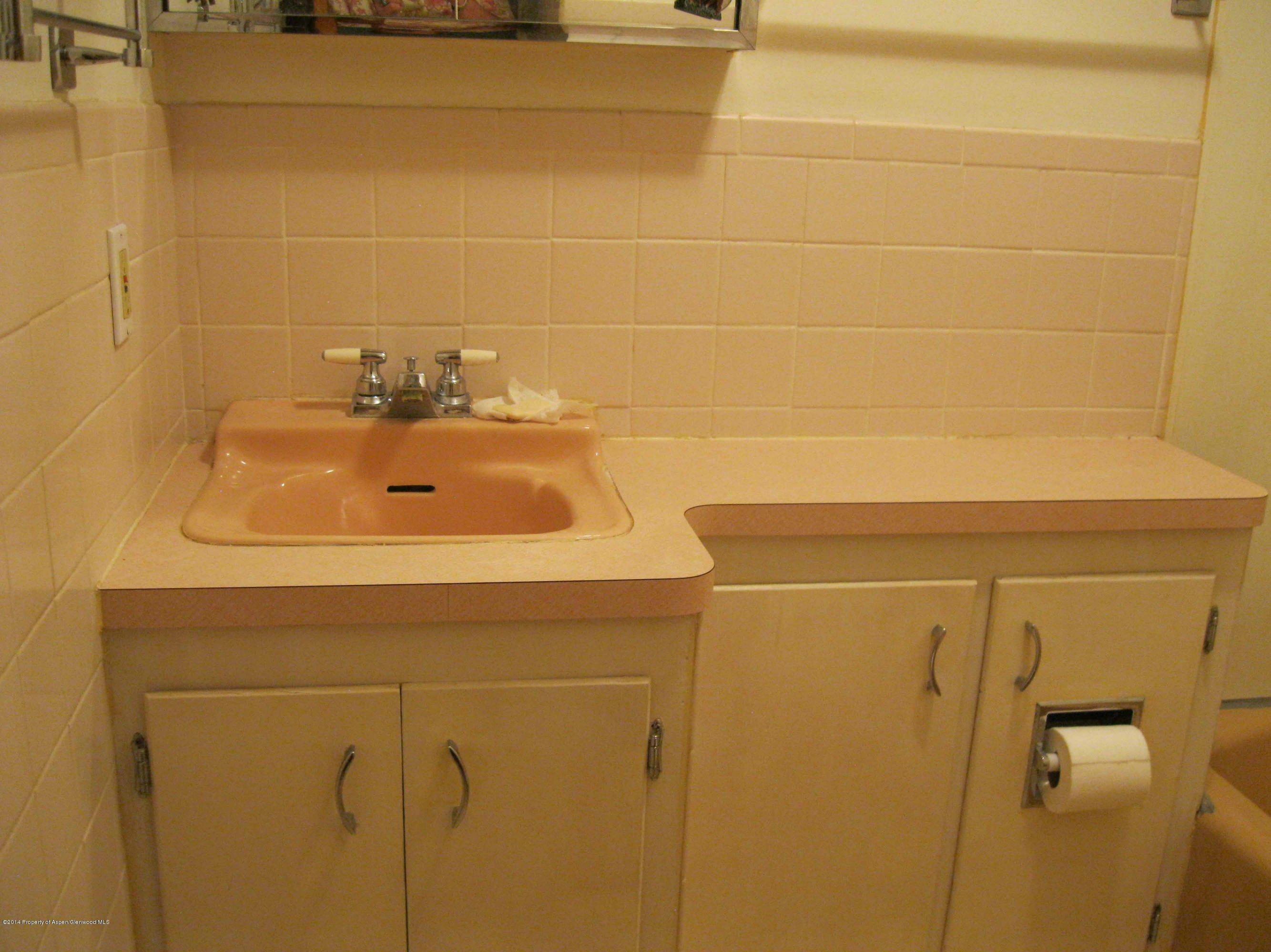 506 County Road 294 Rifle, CO 81650 - Photo 13 of 23 a bathroom with a sink and a tub
