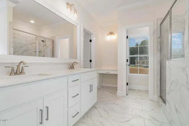 a spacious bathroom with a granite countertop sink a toilet and a bathtub
