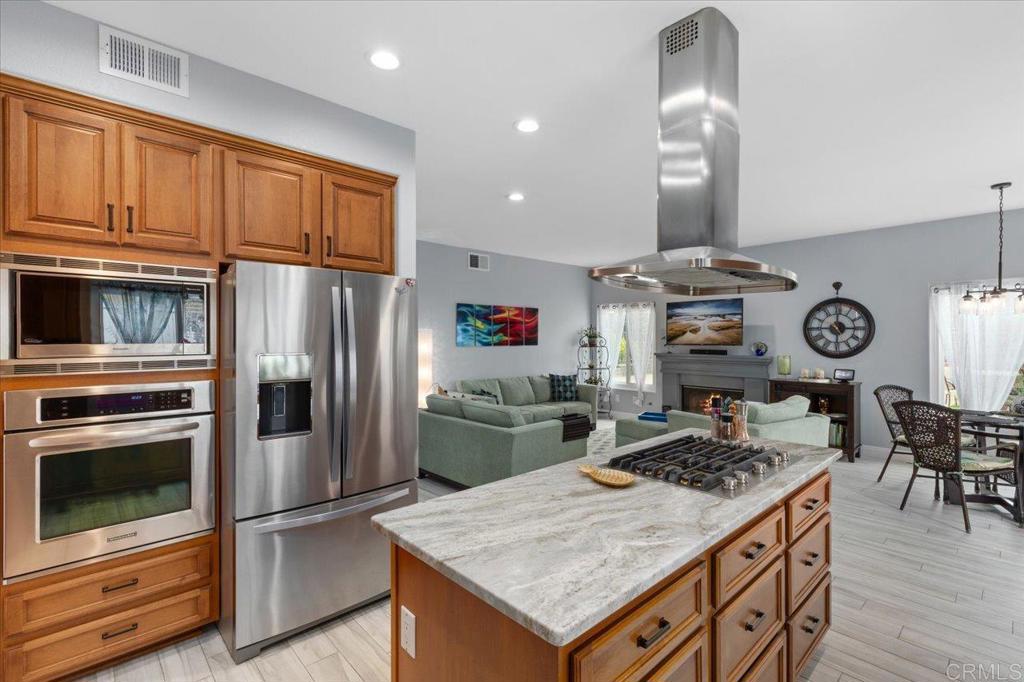 1838 Samoa Way Oceanside, CA 92054 - Photo 19 of 49 a kitchen with a stove and a refrigerator