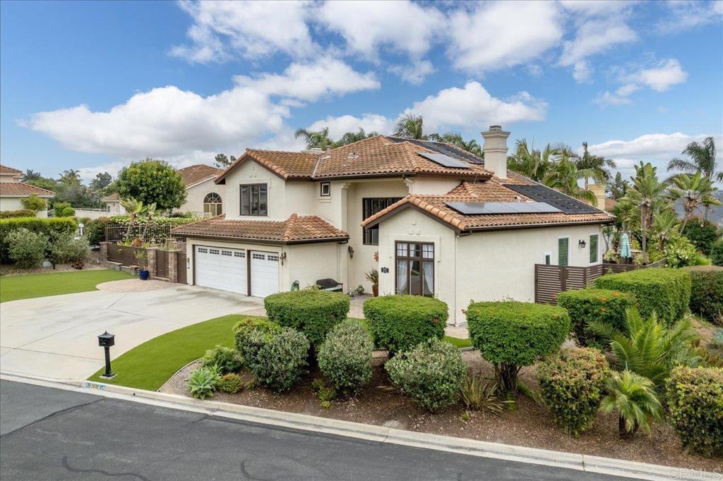 1838 Samoa Way Oceanside, CA 92054 - Photo 2 of 49 a front view of a house with a garden