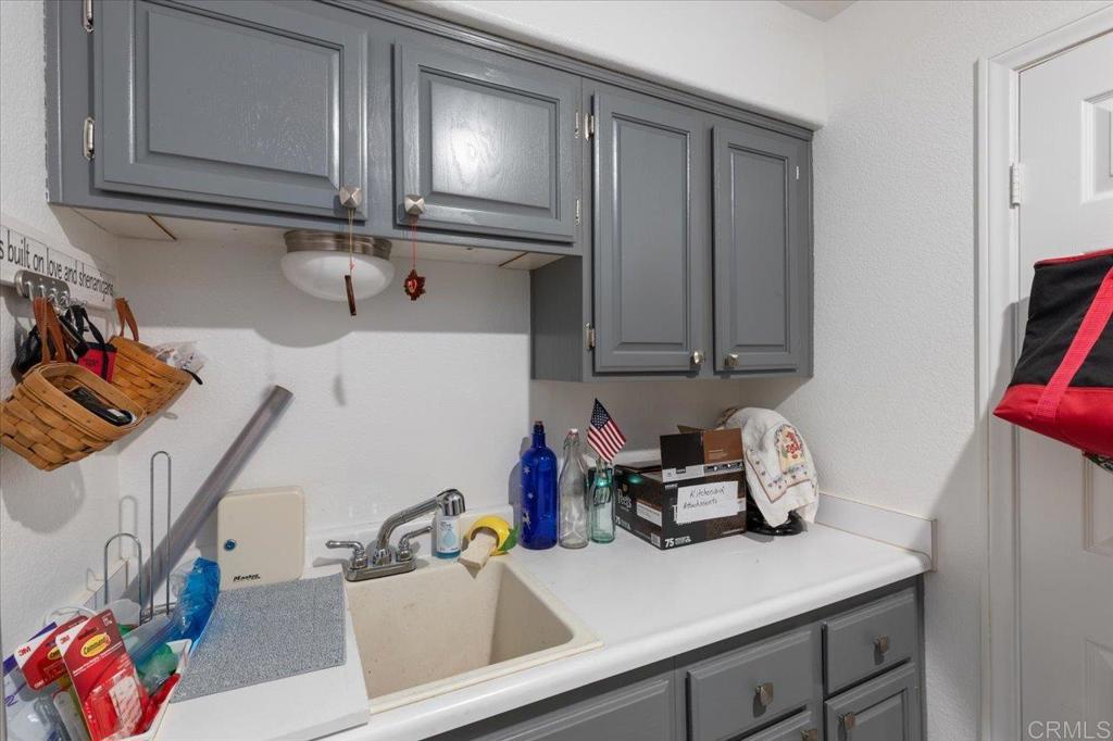 1838 Samoa Way Oceanside, CA 92054 - Photo 21 of 49 a kitchen with a refrigerator and sink